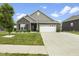 Charming single-story home with brick and siding, a two-car garage, and a well-manicured lawn at 998 Cherry Tree Ln, Greenwood, IN 46143