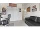 The carpeted home office with closet and a comfortable seating area at 998 Cherry Tree Ln, Greenwood, IN 46143