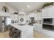 Well-equipped kitchen with stainless steel appliances, a large island, and stylish barstool seating at 998 Cherry Tree Ln, Greenwood, IN 46143
