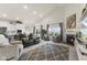 Open-concept living room with high ceilings, a fireplace, and a view of the eat-in kitchen at 998 Cherry Tree Ln, Greenwood, IN 46143