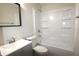 Updated bathroom with a new vanity, modern fixtures, and a shower-tub combination at 1021 Harney Dr, Lebanon, IN 46052
