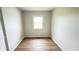 Cozy bedroom with a hardwood floor and a bright window at 1021 Harney Dr, Lebanon, IN 46052