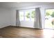 Inviting living room with hardwood floors, large window, and neutral decor at 1021 Harney Dr, Lebanon, IN 46052