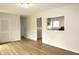 The living room has wood floors with an adjacent view of the kitchen at 1021 Harney Dr, Lebanon, IN 46052