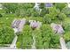 Aerial view of the property showcasing its mature trees and landscaped surroundings at 10697 Woodmont Ln, Fishers, IN 46037