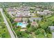 Aerial view of community recreation center with swimming pool, tennis courts, and playground at 10697 Woodmont Ln, Fishers, IN 46037