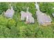 Aerial view of a home, showing the backyard, deck, and mature landscaping at 10697 Woodmont Ln, Fishers, IN 46037