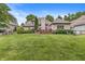 Expansive backyard with lush lawn, patio and beautiful landscaping at 10697 Woodmont Ln, Fishers, IN 46037