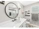 Bright bathroom with modern fixtures and walk in shower with glass wall at 10697 Woodmont Ln, Fishers, IN 46037