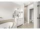 Bathroom featuring a soaker tub, walk in shower, and white cabinets at 10697 Woodmont Ln, Fishers, IN 46037