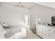 Bedroom featuring vaulted ceiling, white furniture, and ensuite bathroom at 10697 Woodmont Ln, Fishers, IN 46037