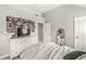 Bedroom showcasing a white dresser, full-length mirror, and door to the hallway at 10697 Woodmont Ln, Fishers, IN 46037
