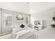 Bright bedroom featuring vaulted ceiling, vanity, and white furniture at 10697 Woodmont Ln, Fishers, IN 46037
