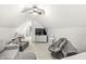 Upstairs bonus room featuring comfortable seating, desk, and TV at 10697 Woodmont Ln, Fishers, IN 46037