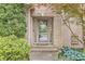 The home features a charming front entrance with a decorative glass door and lovely landscaping at 10697 Woodmont Ln, Fishers, IN 46037