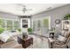 Cozy living room with a comfortable sofa, recliner, and built-in shelving at 10697 Woodmont Ln, Fishers, IN 46037