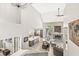 View from the staircase overlooking the living room, kitchen, and dining area at 10697 Woodmont Ln, Fishers, IN 46037
