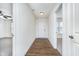 Inviting foyer with wood flooring leads to the living spaces and bedrooms at 107 Elliott Ave, Trafalgar, IN 46181