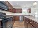 Well-equipped kitchen with wooden cabinets, a dishwasher, and countertops for an efficient cooking space at 107 Elliott Ave, Trafalgar, IN 46181