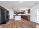 Well-equipped kitchen with dark wood cabinets, central island, and stainless steel appliances at 107 Elliott Ave, Trafalgar, IN 46181