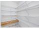 Walk-in pantry with ample shelving and storage space for organized kitchen essentials at 107 Elliott Ave, Trafalgar, IN 46181