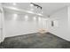 Spacious basement area with gray patterned carpet, white walls, and recessed lighting at 10722 Landsbrook N Run, Noblesville, IN 46060