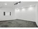 Large unfinished basement space featuring concrete floors, white walls, and track lighting at 10722 Landsbrook N Run, Noblesville, IN 46060