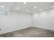 Unfinished basement space with concrete floors, white walls, and a small window at 10722 Landsbrook N Run, Noblesville, IN 46060