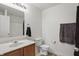 Bathroom with neutral colors, vanity with sink, toilet, and towel racks at 10722 Landsbrook N Run, Noblesville, IN 46060