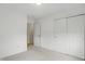 Bedroom features neutral carpet, an open doorway, white walls, and sliding door closet at 10722 Landsbrook N Run, Noblesville, IN 46060