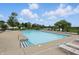 Large community pool with plenty of lounge chairs and a well-maintained deck at 10722 Landsbrook N Run, Noblesville, IN 46060