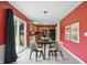 An eat-in kitchen with stainless appliances and tile floors is adjacent to a dining area with access to the yard at 10722 Landsbrook N Run, Noblesville, IN 46060