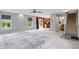 Open-concept living room with neutral walls, plush carpet, and lots of natural light at 10722 Landsbrook N Run, Noblesville, IN 46060