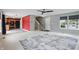 Open-concept living area showcasing neutral walls, plush carpet, and an adjacent kitchen at 10722 Landsbrook N Run, Noblesville, IN 46060