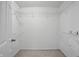 Walk-in closet with shelving for storage and a carpeted floor at 10722 Landsbrook N Run, Noblesville, IN 46060