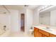 Bright bathroom showcasing a shower-tub combo, and a vanity with wood cabinets at 1129 Central Park S Blvd, Greenwood, IN 46143