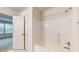 Bright bathroom featuring a white shower-tub combo, offering a clean and simple design at 1129 Central Park S Blvd, Greenwood, IN 46143