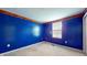 Bright blue bedroom with large window and light carpet at 1129 Central Park S Blvd, Greenwood, IN 46143