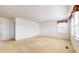 Expansive bedroom with window offering natural light and an open doorway to another room at 1129 Central Park S Blvd, Greenwood, IN 46143