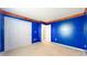 Vibrant blue bedroom features a spacious closet and bright carpet at 1129 Central Park S Blvd, Greenwood, IN 46143
