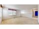Spacious living room featuring a window and open access to the upper floor hall area at 1129 Central Park S Blvd, Greenwood, IN 46143