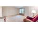 Cozy living room with carpet and a comfortable armchair by the window at 1129 Central Park S Blvd, Greenwood, IN 46143