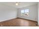 Bright bedroom with a large window and wood flooring, creating a cozy and inviting atmosphere at 11531 Short Iron Ln, Indianapolis, IN 46235