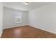 Bedroom with hardwood floors, a window, and ample natural light at 11531 Short Iron Ln, Indianapolis, IN 46235
