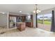 Modern eat-in kitchen featuring stainless steel appliances, tile backsplash, and a kitchen island at 11531 Short Iron Ln, Indianapolis, IN 46235