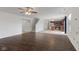 Open-concept living room with hardwood floors leading into an eat-in kitchen with an island at 11531 Short Iron Ln, Indianapolis, IN 46235