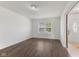 Bright and airy living room with hardwood floors and large windows, offering a welcoming space at 11531 Short Iron Ln, Indianapolis, IN 46235