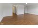 Bright living room with wood floors and views to other rooms in the home at 11531 Short Iron Ln, Indianapolis, IN 46235