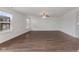 Bright, spacious living room with large windows and hardwood floors, offering ample natural light at 11531 Short Iron Ln, Indianapolis, IN 46235