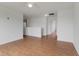 Spacious loft area with laminate wood flooring, perfect for a home office or additional living space at 11531 Short Iron Ln, Indianapolis, IN 46235